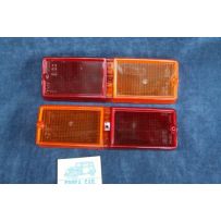 128 SEDAN 1°S  PAIR REAR LENSES   STARS