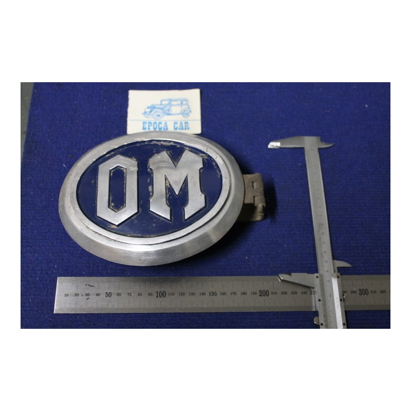 BADGE "OM" LENGHT 180 mm METAL IN BLAU BACKGROUND